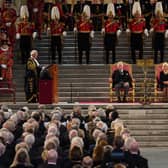 King Charles III and the Queen Consort listen to Speaker of the House of Lords Lord McFall of Alcluith (left) at Westminster Hall. Credit: PA