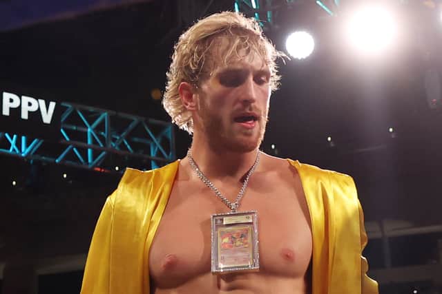 Logan Paul, seen here wearing a Charizard Pokemon Card, is the current owner of the most expensive Pokemon card to be sold
