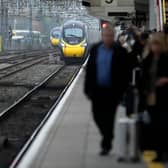 Passengers wait to board an Avanti West Coast mainline train at Crewe Station on December 01, 2022 in Crewe, England. The Rail, Maritime and Transport workers union (RMT) said its members will strike on eight days - December 13, 14, 16 and 17, and January 3, 4, 6 and 7 - the latest episode in a dispute over pay and working practices. (Photo by Christopher Furlong/Getty Images)