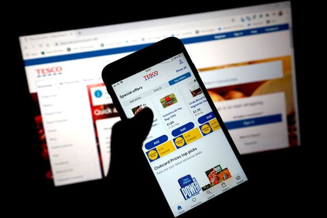 Tesco Clubcard vouchers also appear digitally in the supermarket’s app or online (image: Getty Images)