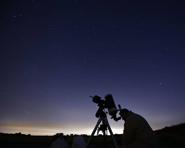 Members of the York Astronomical Society prepare to view the annual Perseids meteor shower in the village of Rufforth, near York, in August 2015 (Photo: OLI SCARFF/AFP via Getty Images)
