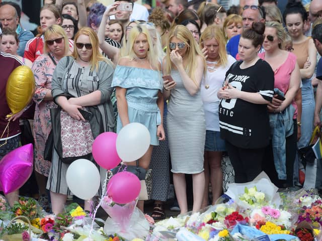 Floral tributes after a minute's silence in St Ann's Square, Manchester, to remember the victims of the terror attack in the city. A report examining security at Manchester Arena where 22 people were murdered and hundreds were injured in a suicide bombing at the end of an Ariana Grande concert in May 2017 was published today. (Photo: PA)