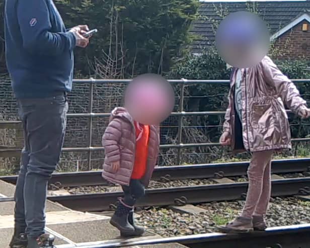 Shocking footage shows young children being played on the tracks 