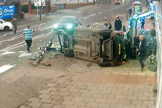 CCTV capturing the dramatic moment a mum managed to pull her two-year-old daughter to safety seconds before her pram was crushed underneath a car in a heart-stopping crash (SWNS)