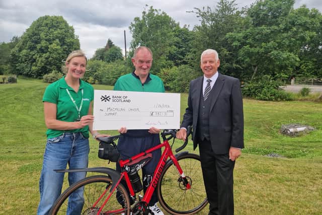 Brother Jim Aitken Past Master of Lodge Lindores No. 106 Presents £7,821.31 to Macmillan Cancer Care