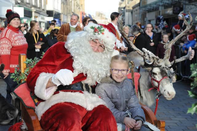 Santa, pictured here with last year's winner Lyla Steel (then aged 7), returns to Kirkcaldy with his reindeer for Sunday's parade.  Pic: George McLuskie.