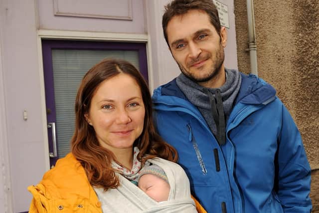 Hajni and Liviu Vasilescu with baby Artur. Picture: Fife Photo Agency