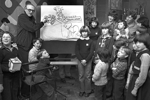 RETRO 1979 Cartoonist Bill Tidy opens the Christmas  fair at Mere Oaks School Standish
