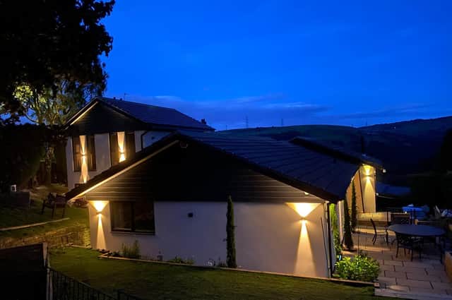 Outdoor lighting creates a spectacular vision at night. The property has a full security system too.