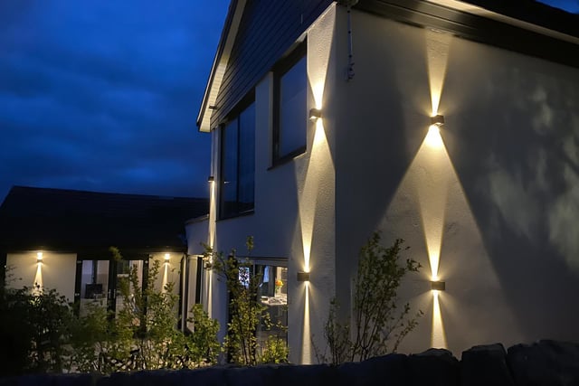 The lighting system illuminates all parts of the property by night