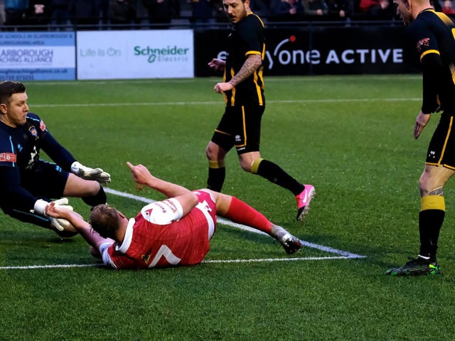 Jake Day loses his footing while attempting an effort at goal for Scarborough Athletic v Morpeth Town.

Photo by Richard Ponter