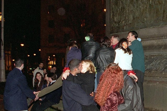 New Year's Eve revellers in Leeds City Square seeing in 1998.
