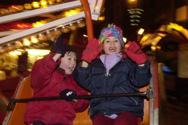 Edward Soper, 4, and Eleanor McKee, 6, from Headingley, enjoy the fairground on Greek Street on Sunday December 31.