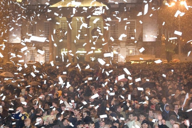 Thousands celebrate the New Year outside Leeds Civic Hall in December 31, 2002.