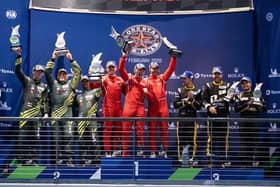 Jonny Adam (centre right in red) on the podium at Circuit of the Americas.
