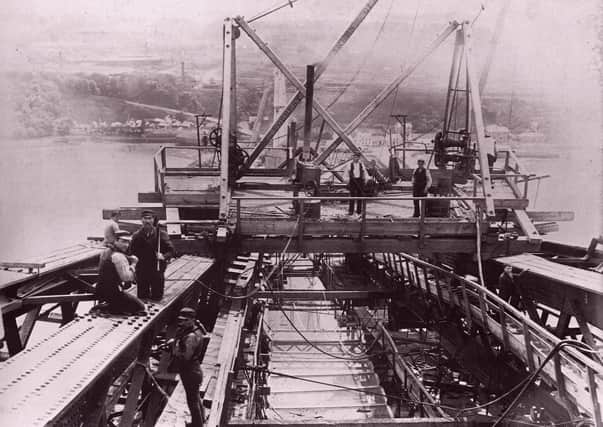 Workers building the Forth Bridge in June 1888.