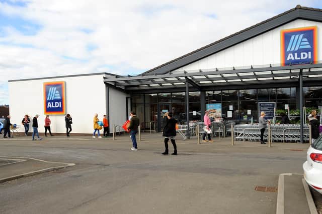 Social distancing being observed in the queue at Aldi in Kirkcaldy. Pic: Fife Photo Agency.