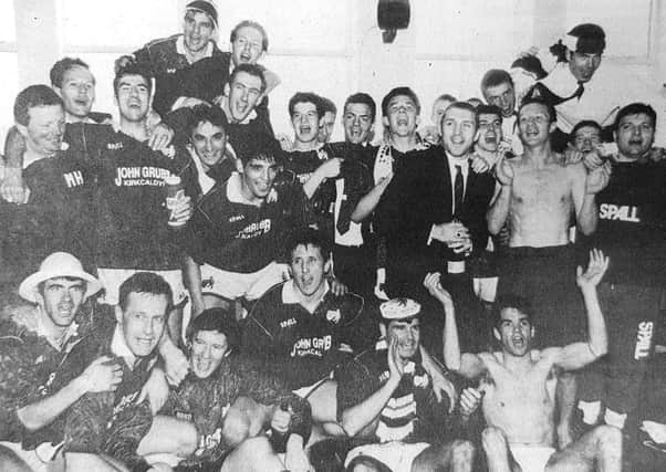 Raith Rovers players celebrate after the club won promotion to the Scottish Premier Division in 1993.