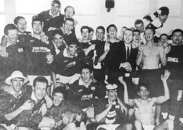Raith Rovers players celebrate after the club won promotion to the Scottish Premier Division for the very first time.