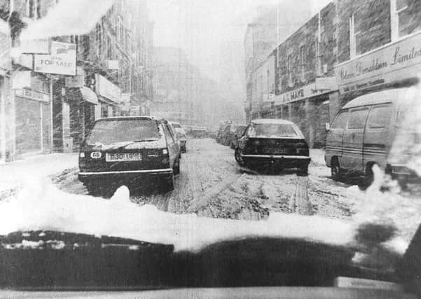 A driver's view of the snow on the High Street in 1993.