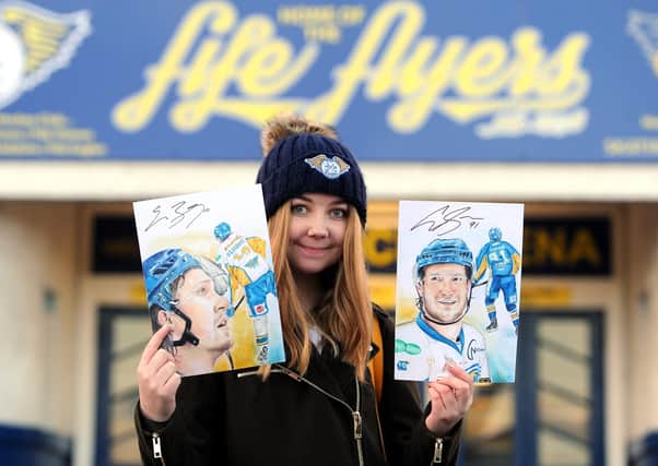 Student Rebecca Thomson with some of her earlier portraits of Fife Flyers players -  credit- Fife Photo Agency