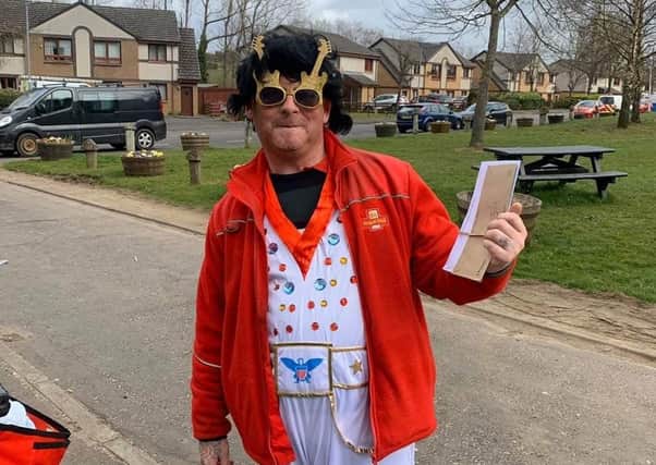 Postman David Barbour dressed up as Elvis on his rounds.