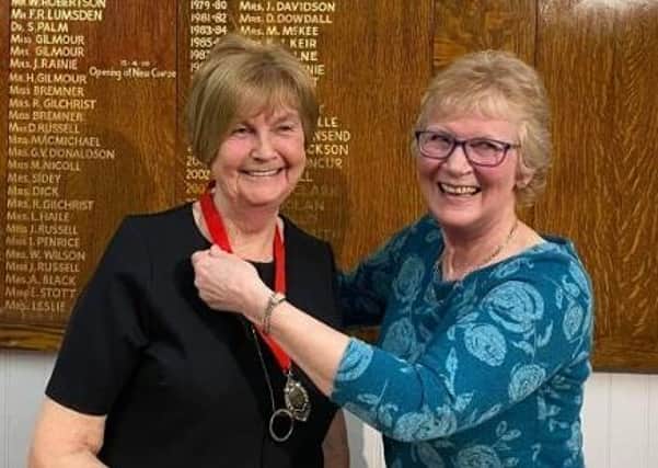 Retiring captain Linda Mould presented new captain Senga Hogg with the chain of office at the AGM on March 11