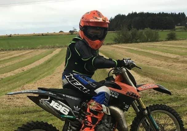 Ramsay Adamson from Radernie is pictured sitting on the KTM-80 that was stolen in February