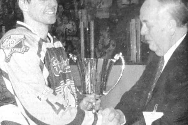 Captain Frank Morris receives the British National Championship trophy