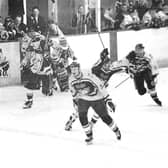 Flyers players race from the bench after winning the British National Championship in April 1999.