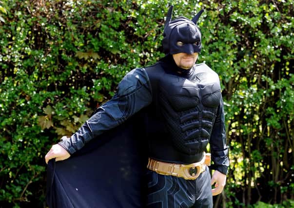 Mark has been doing his daily walk dressed as Batman, and cheering up the local children during Lockdown.  Pic: Fife Photo Agency