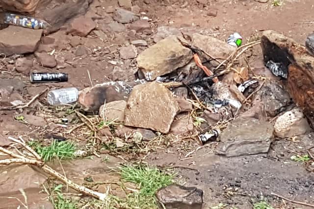 Bottle, cans, rubbish, and the remnants of a fire inside Seafield Tower.