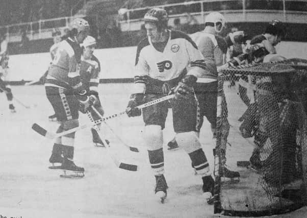 John Taylor in a game from the 1977-78 season.