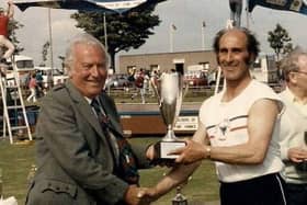 Sir George Sharp presents 1984 200 metres winner Joe Baird with his prize