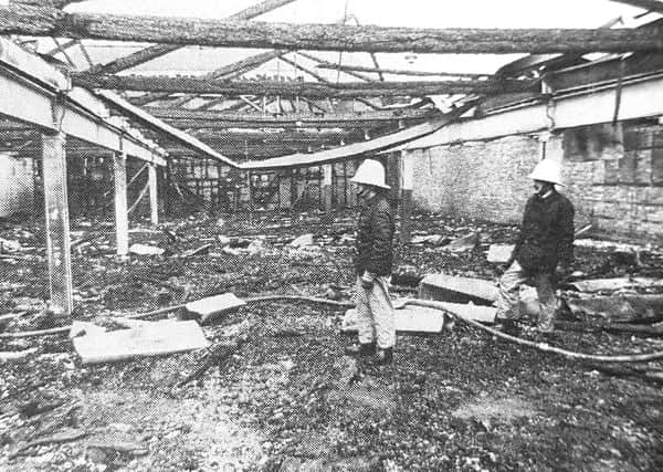 A fire crew survey the aftermath of the blaze at Kirkcaldy Alma Bowl in July 1990.