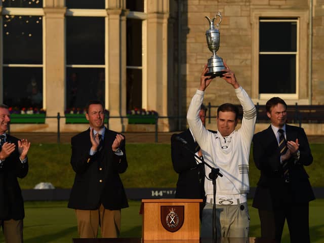 Zach Johnson  holds the Claret Jug after winning the 144th Open Championship at The Old Course in St Andrews.  (Photo by Stuart Franklin/Getty Images)