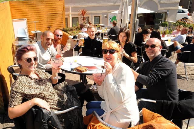 Toasting the sunshine at the Cafe Continental.