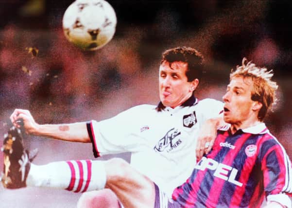 Ronnie Coyle battles with Bayern's Jurgen Klinsmann. (Pic: Robert Perry)