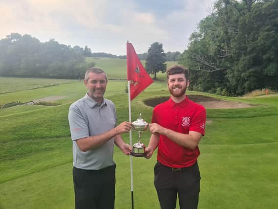 Kevin Blyth, captain of Kirkcaldy Golf Club, left, with Liam Duncan, Dunnikier Park’s club champion, displaying the Millennium Cup.