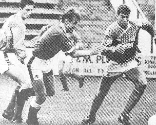 Raith's Ian Ferguson (left) and Craig Brewster (right) challenge Hearts' Gary Mackay in a pre-season friendly in 1991.