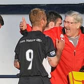 Brian Marr congratulates Johnny Russell after a Raith Rovers win against Queen of the South in 2010.