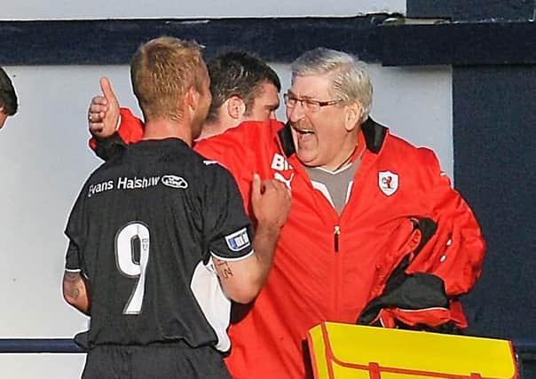 Brian Marr congratulates Johnny Russell after a Raith Rovers win against Queen of the South in 2010.