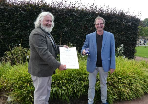 Keith receiving the award.