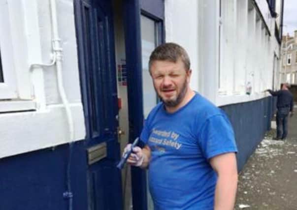 Painting the main door at Stark's Park