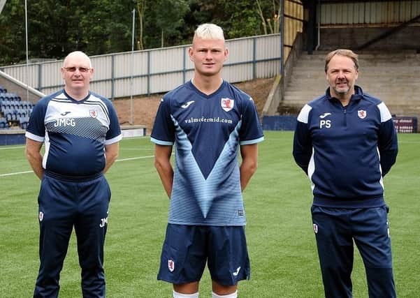 New Raith Rovers signing, 16-year-old Luke Mahady  with manager John McGlynn and Paul Smith (assistant).