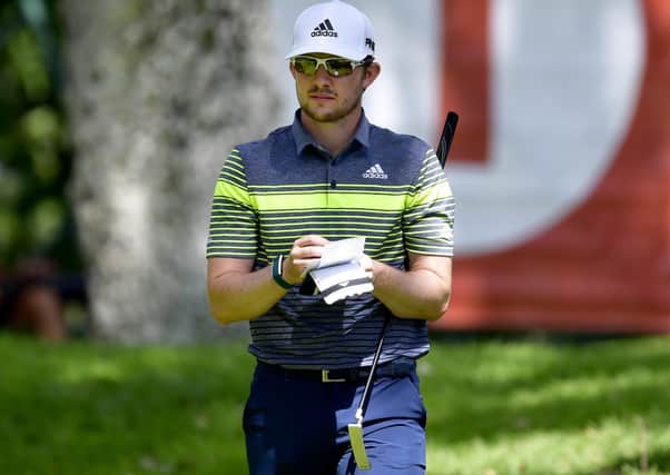 Connor Syme checks his scorecard during the Estrella Damm N. A. Andalucia Masters golf tournament at Real Club Valderrama in Spain. (picture by Octavio Passos/Getty Images)