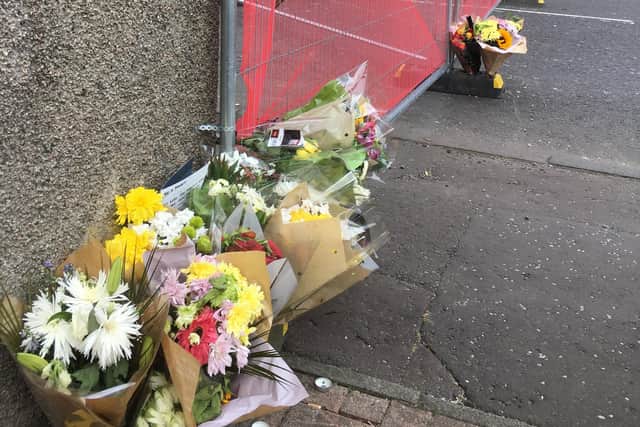 People left flowers at the site of the crash. Picture: George McLuskie.