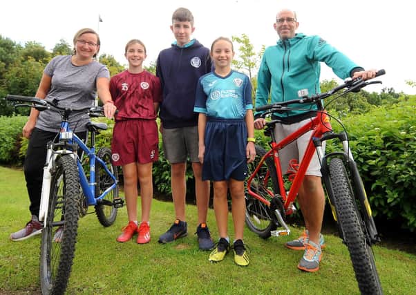 Cathy and Neil Husband with their children -  Jessica, Callum and Erin.  who took part in  the Kirkcaldy High School 'World Travel' PE Challenge from May until the end of the school term, using Strava. Pic:  Fife Photo Agency.
