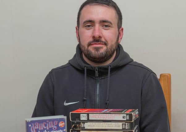 Raith Rovers fan Daniel Elder with some of his old VHS tapes.