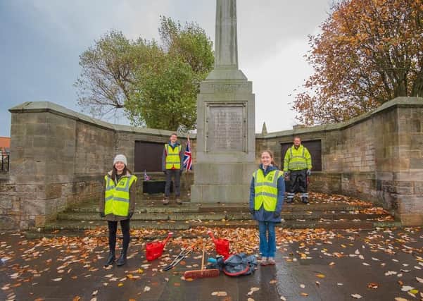 Students helped clean up the St Andrews war memorial.